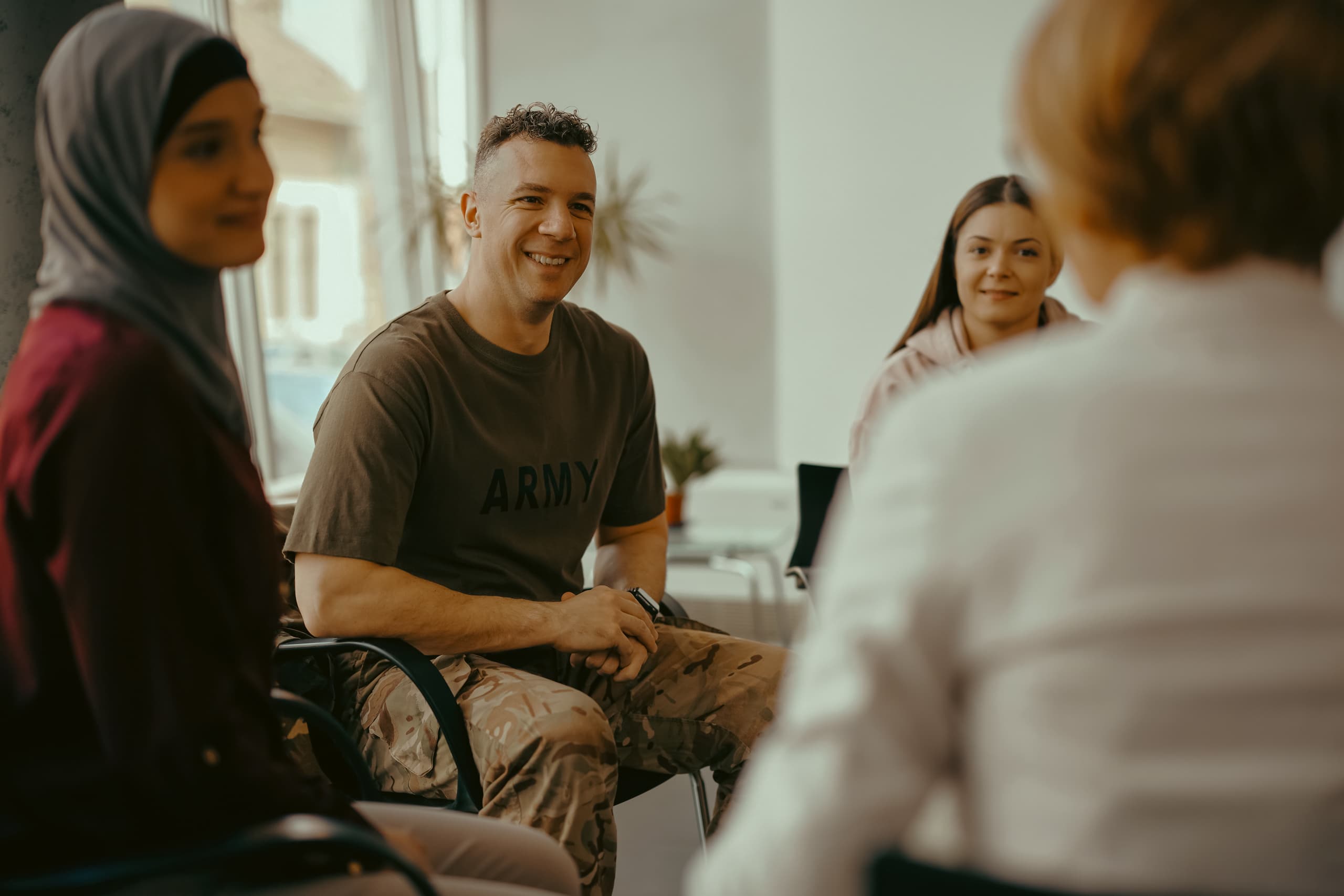 Veterans in Florida gathered in a military support group discussing gambling recovery with Playwise.